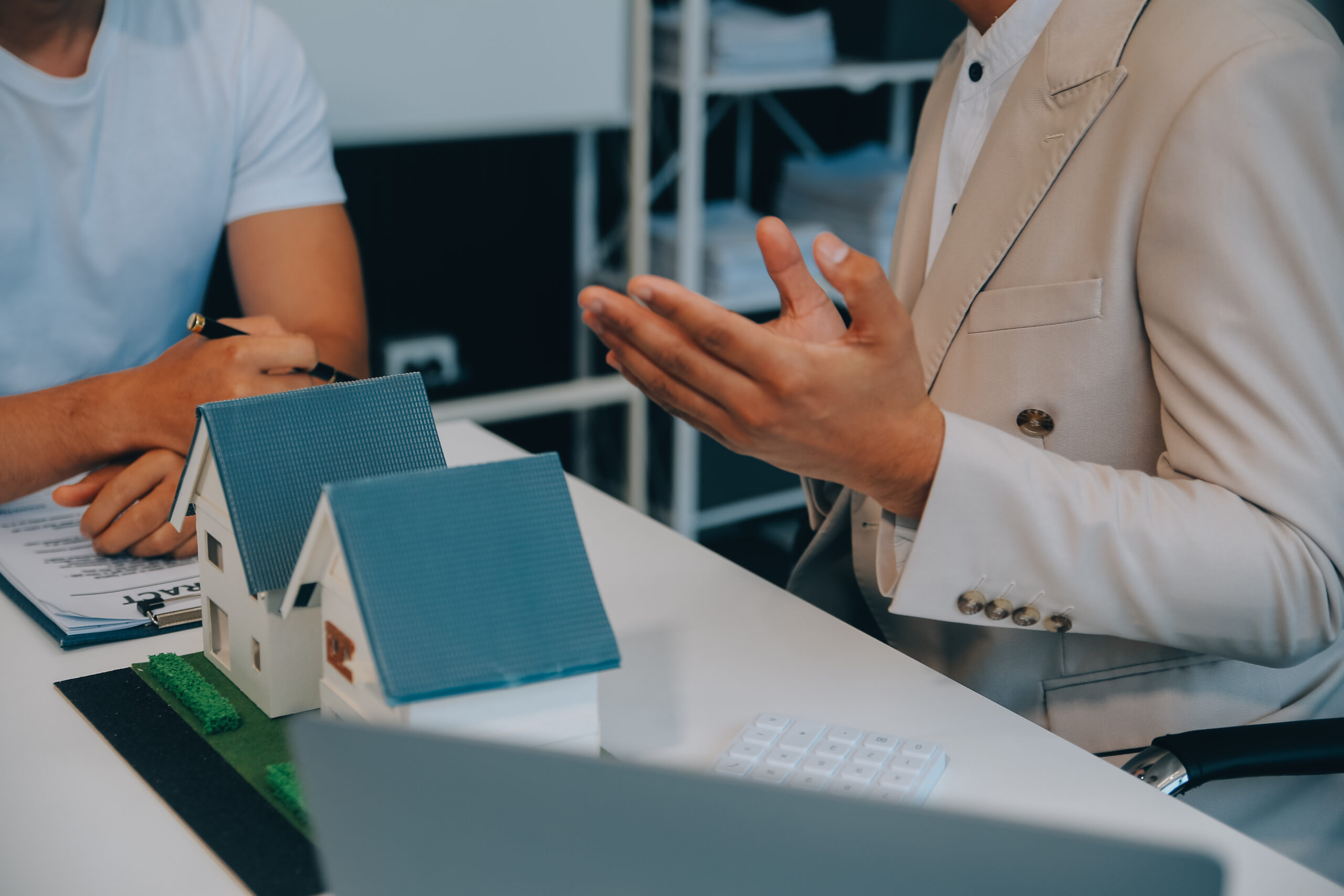 Real estate agent talked about the terms of the home purchase agreement and asked the customer to sign the documents to make the contract legally, Home sales and home insurance concept.