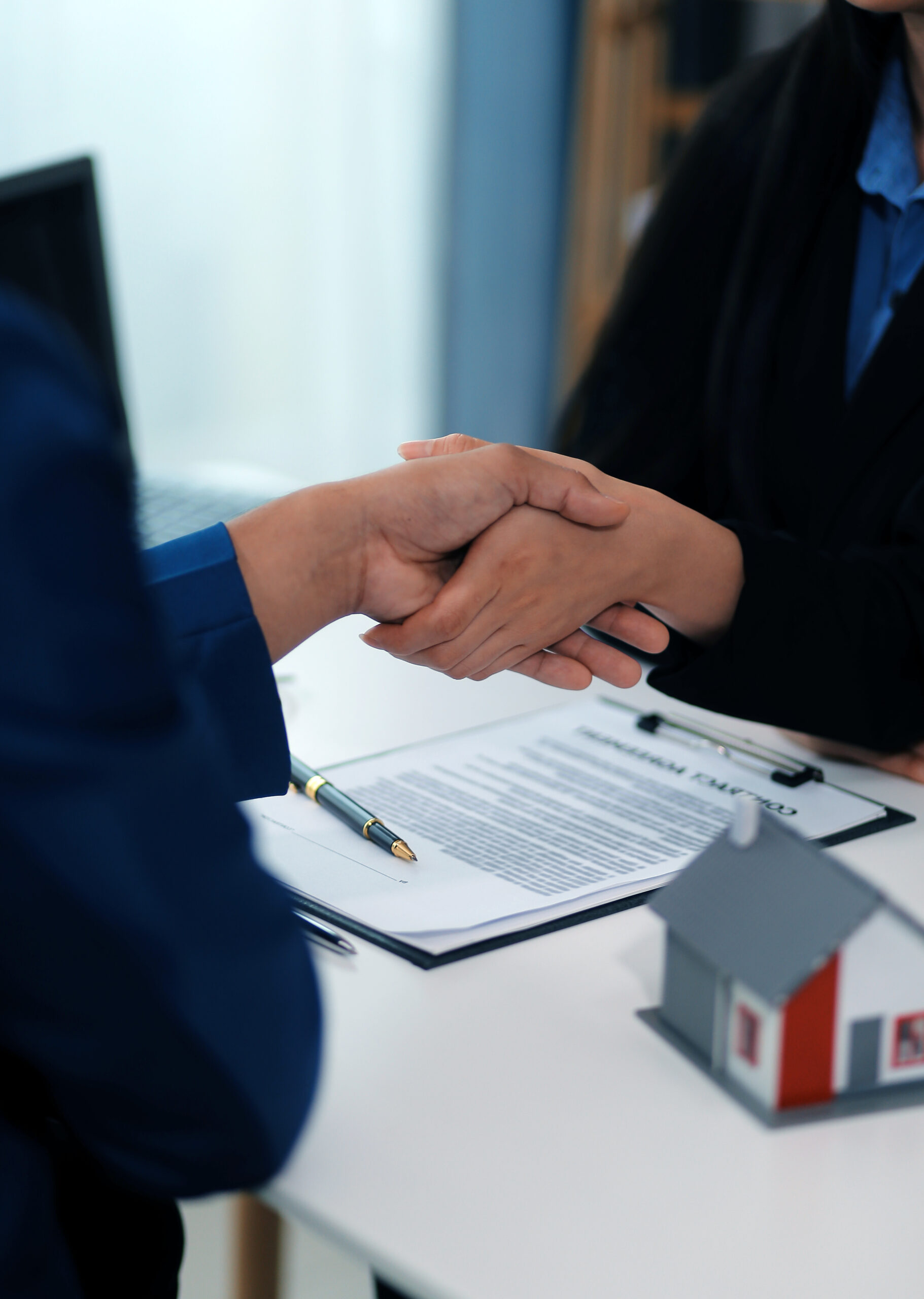 Sale representative offer house purchase contract to buy a house or apartment or discussing about loans and interest rates